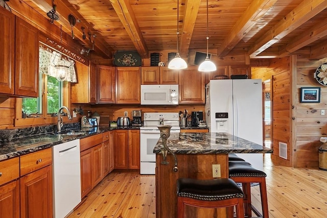 8 Turk Hollow Rd, Oxford, MA 01540 - kitchen with light wood finished floors, wooden walls, white appliances, and a sink