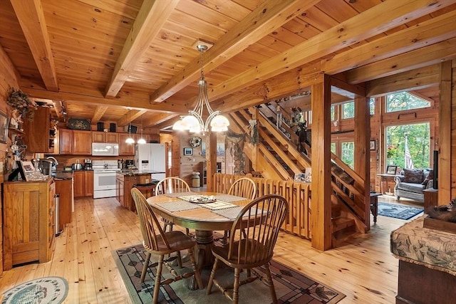 8 Turk Hollow Rd, Oxford, MA 01540 - dining space featuring beamed ceiling, wood ceiling, a chandelier, and light wood finished floors