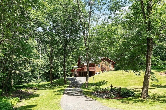 8 Turk Hollow Rd, Oxford, MA 01540 - surrounding community with a view of trees, a lawn, gravel driveway, and a deck