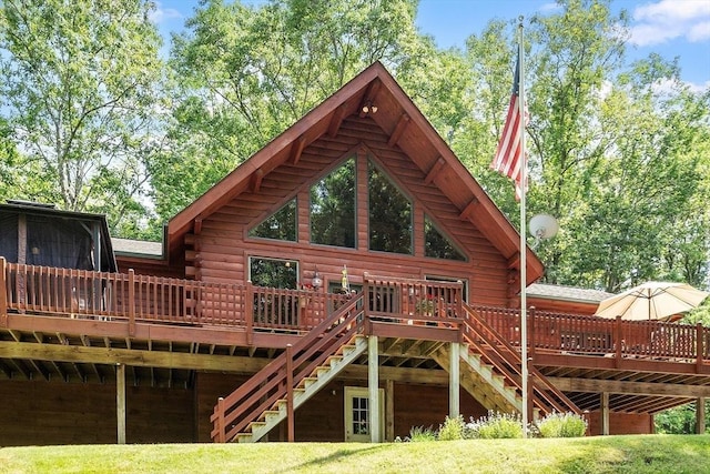 8 Turk Hollow Rd, Oxford, MA 01540 - rear view of property with log siding, stairway, and a wooden deck