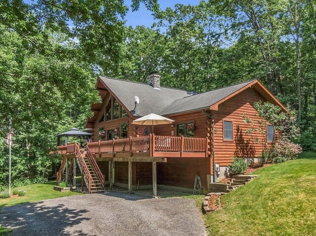 8 Turk Hollow Rd, Oxford, MA 01540 - view of front of property with stairs, a front lawn, log siding, and a chimney