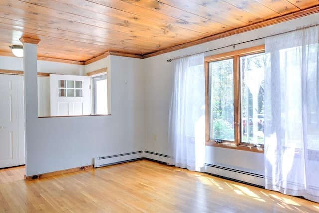 unfurnished room with wood ceiling, plenty of natural light, and ornamental molding