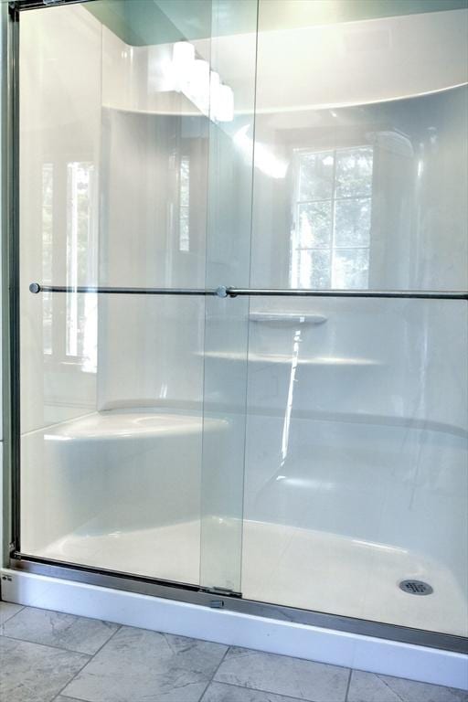 bathroom with a shower stall
