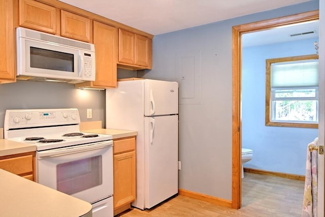 kitchen featuring visible vents, white appliances, baseboards, light countertops, and light wood-style flooring