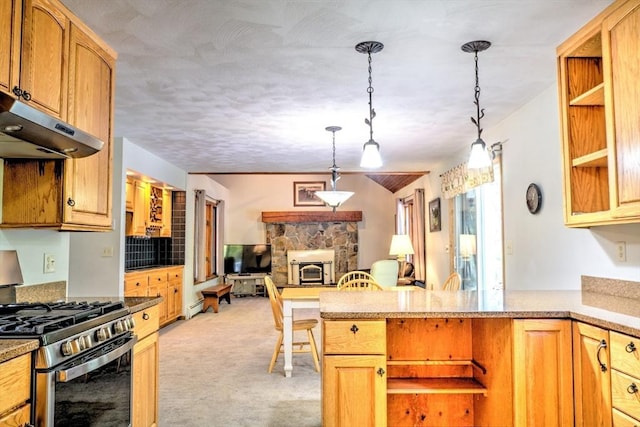 kitchen with light colored carpet, a fireplace, open floor plan, gas range, and under cabinet range hood