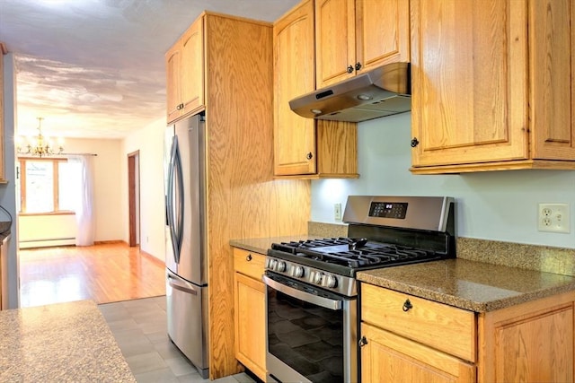 kitchen with an inviting chandelier, light floors, under cabinet range hood, a baseboard radiator, and stainless steel appliances