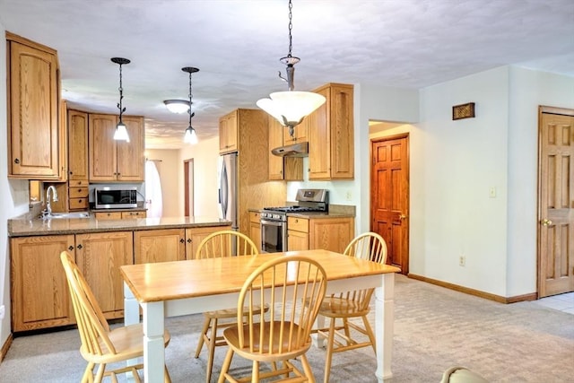 dining space with baseboards and light carpet
