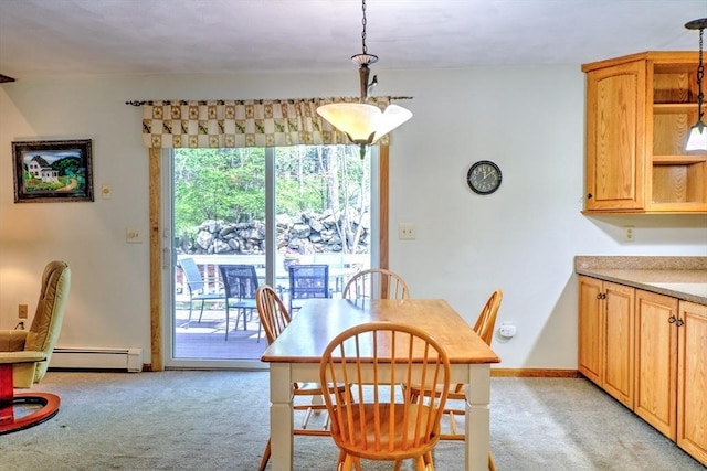dining area with light colored carpet and a baseboard radiator