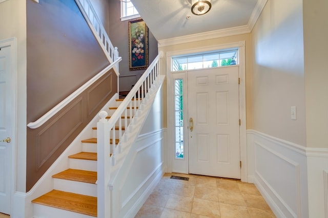 tiled foyer with crown molding