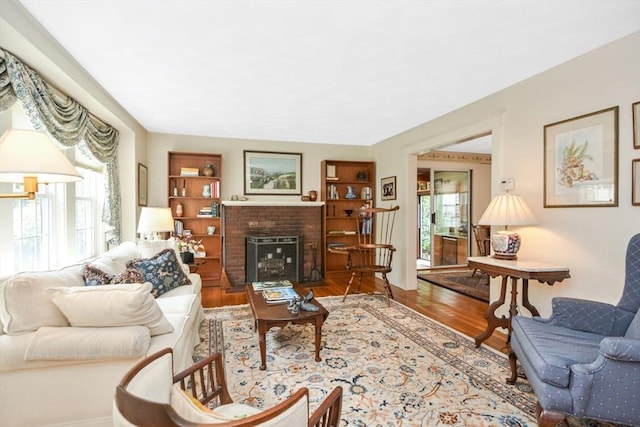21 Stevens Rd, Needham, MA 02492 - living area featuring plenty of natural light, wood finished floors, and a fireplace