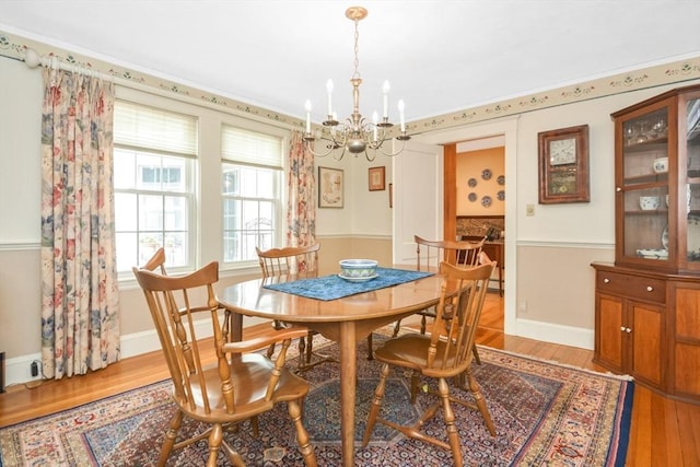 21 Stevens Rd, Needham, MA 02492 - dining space with a chandelier, light wood-type flooring, and baseboards