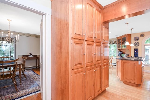 21 Stevens Rd, Needham, MA 02492 - corridor featuring light wood-type flooring, a chandelier, and baseboard heating