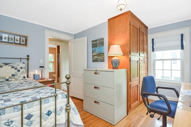21 Stevens Rd, Needham, MA 02492 - bedroom with light wood finished floors, ornamental molding, and refrigerator