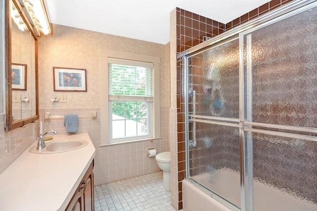 21 Stevens Rd, Needham, MA 02492 - full bathroom featuring vanity, tile walls, healthy amount of natural light, toilet, and tile patterned floors