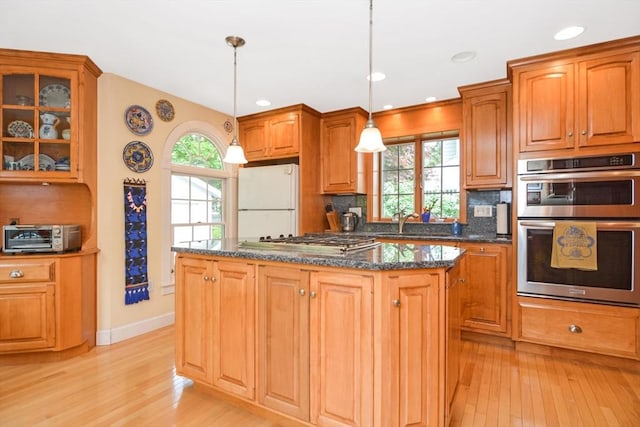 21 Stevens Rd, Needham, MA 02492 - kitchen featuring appliances with stainless steel finishes, light wood finished floors, healthy amount of natural light, and recessed lighting