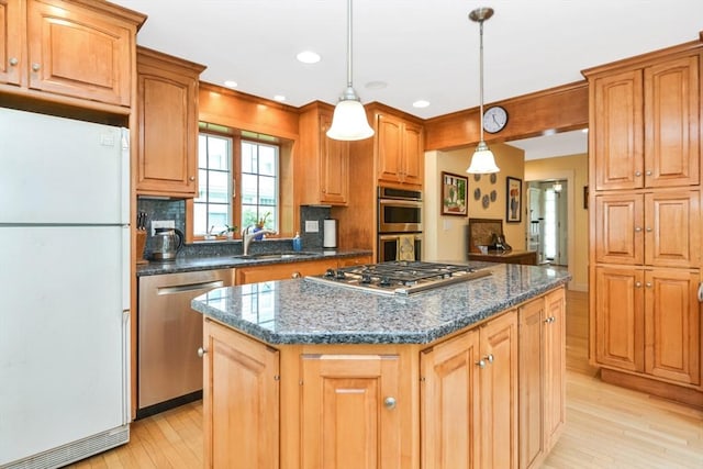 21 Stevens Rd, Needham, MA 02492 - kitchen featuring appliances with stainless steel finishes, a sink, a kitchen island, light wood-type flooring, and recessed lighting
