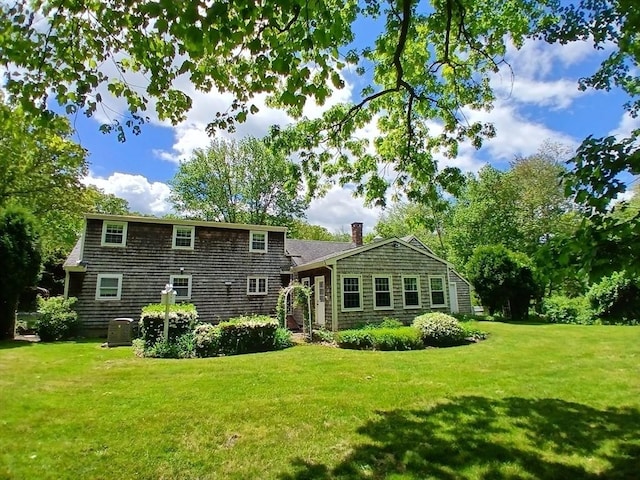 100 D Dr, Westport, MA 02790 - back of house with a lawn and a chimney