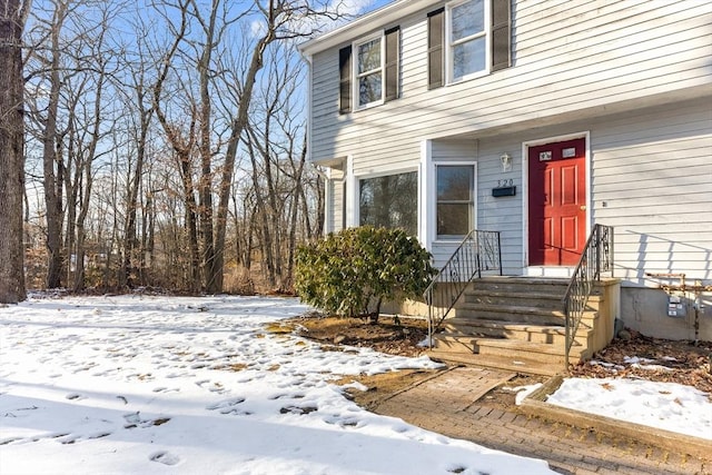 view of snow covered property entrance