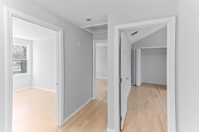 hallway with light wood-type flooring