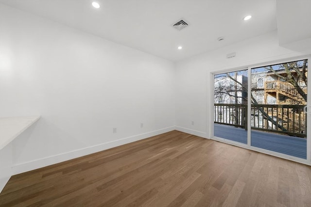 empty room featuring hardwood / wood-style flooring