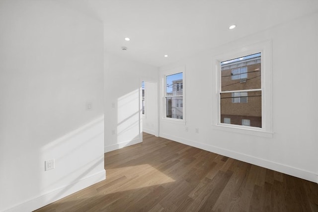 unfurnished room featuring hardwood / wood-style flooring