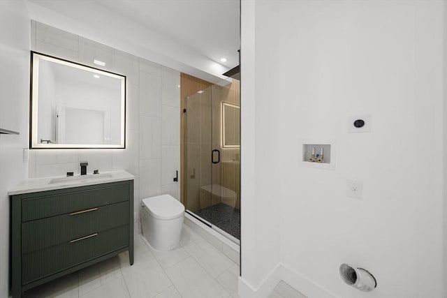 bathroom with tile patterned flooring, vanity, toilet, and a shower with door