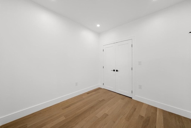 spare room featuring light hardwood / wood-style flooring