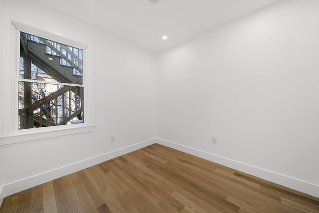 spare room featuring hardwood / wood-style flooring