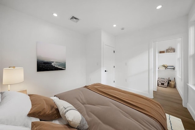 bedroom with hardwood / wood-style floors