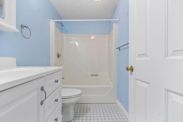 bathroom featuring toilet, bathing tub / shower combination, a textured ceiling, baseboards, and vanity
