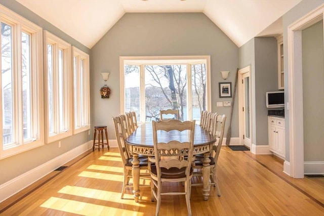 385 Barnes Rd, Oak Bluffs, MA 02557 - dining space featuring light wood-type flooring, lofted ceiling, and baseboards