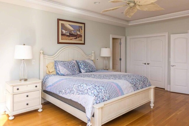 385 Barnes Rd, Oak Bluffs, MA 02557 - bedroom featuring wood finished floors, a closet, crown molding, and ceiling fan