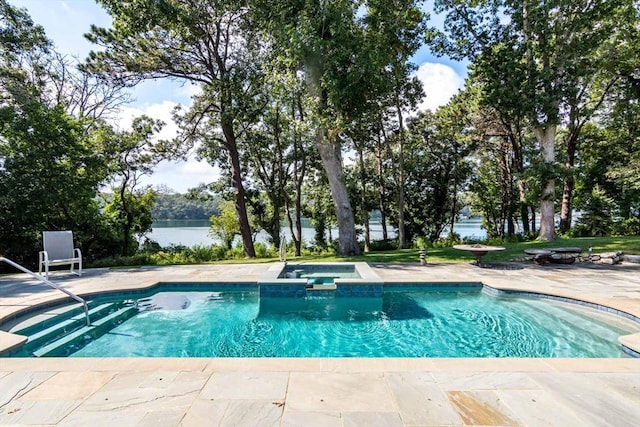 385 Barnes Rd, Oak Bluffs, MA 02557 - view of swimming pool with a water view, a pool with connected hot tub, and a patio area