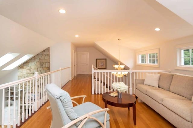 385 Barnes Rd, Oak Bluffs, MA 02557 - living area with a chandelier, vaulted ceiling, an upstairs landing, recessed lighting, and wood finished floors