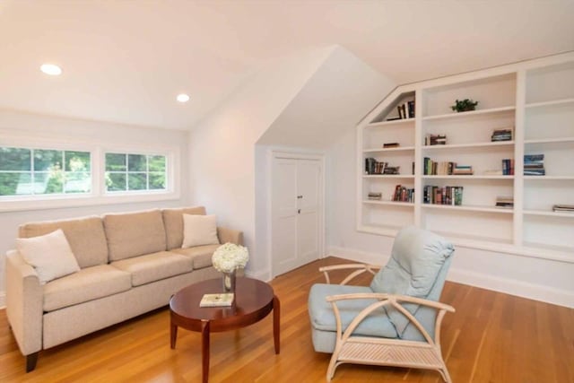 385 Barnes Rd, Oak Bluffs, MA 02557 - living room with lofted ceiling, wood finished floors, baseboards, built in shelves, and recessed lighting