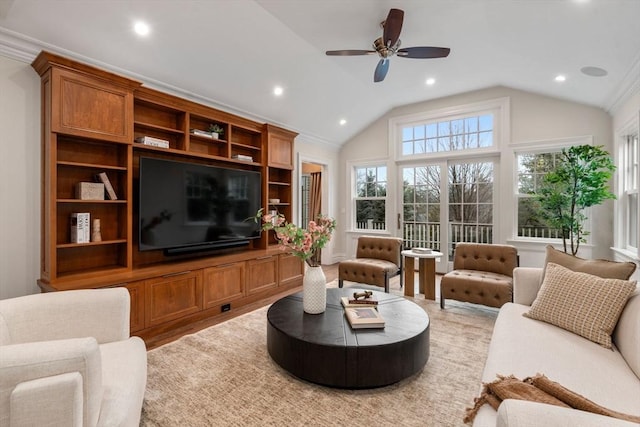 living area featuring lofted ceiling, ceiling fan, ornamental molding, and recessed lighting