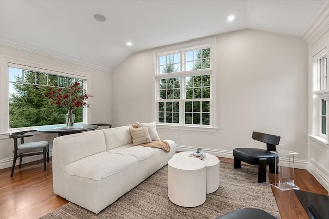 living area featuring lofted ceiling, recessed lighting, wood finished floors, and baseboards