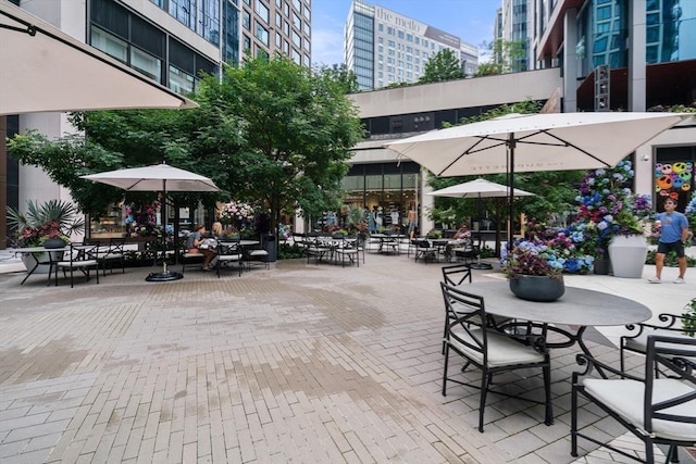 view of home's community with a patio area