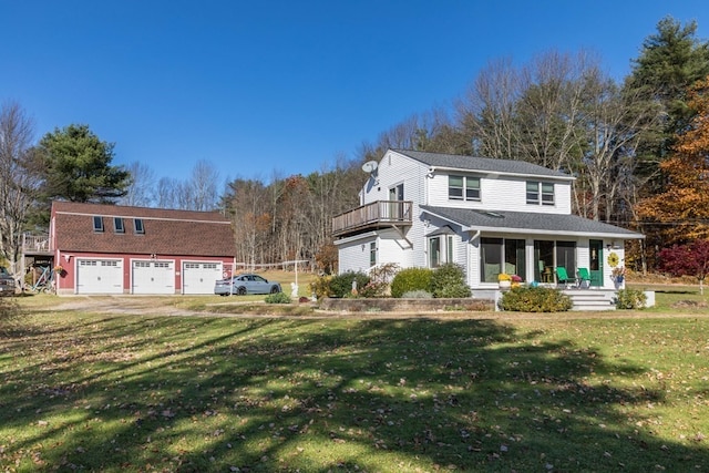 view of front facade featuring a front lawn, covered porch, and a garage