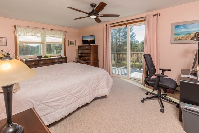 bedroom with access to exterior, light carpet, multiple windows, and ceiling fan