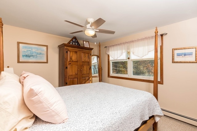 bedroom featuring baseboard heating, carpet flooring, and ceiling fan