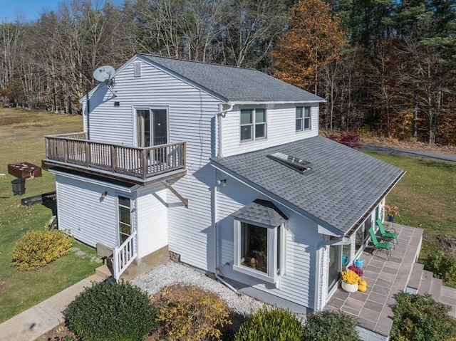 rear view of property with a patio area and a yard