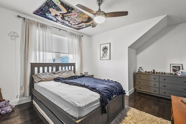 bedroom featuring ceiling fan and dark hardwood / wood-style floors