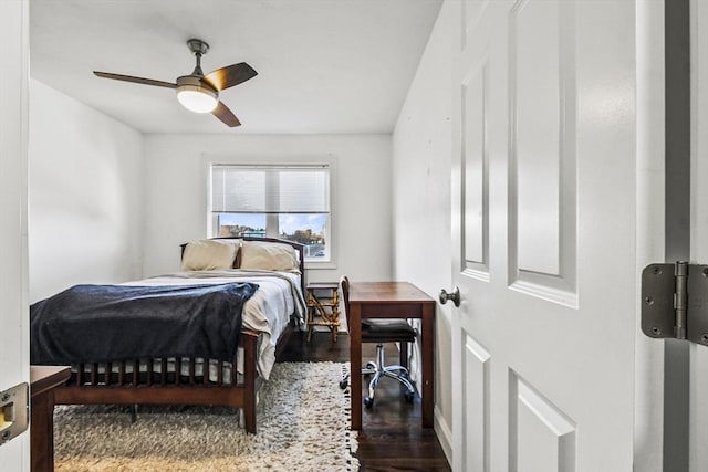 bedroom with ceiling fan and dark hardwood / wood-style flooring