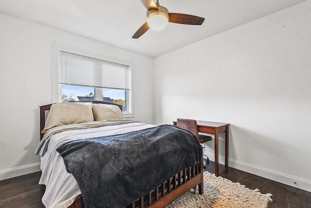 bedroom with ceiling fan and dark hardwood / wood-style floors