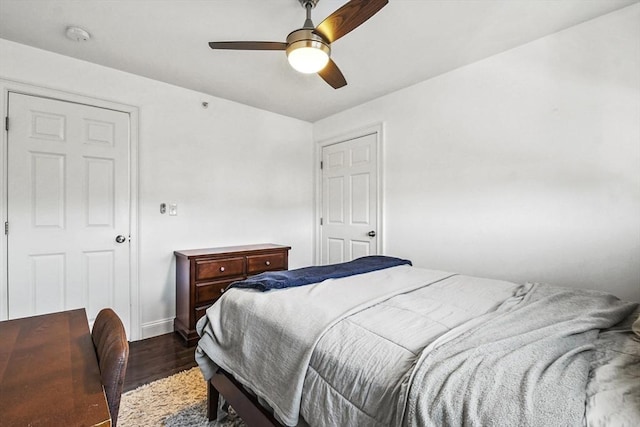 bedroom featuring ceiling fan and dark hardwood / wood-style floors