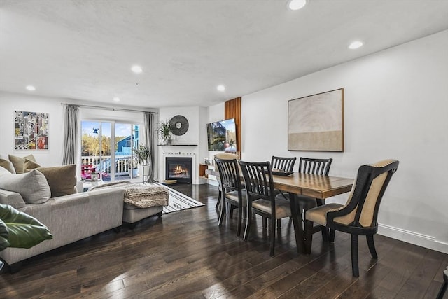 dining space with dark wood-type flooring