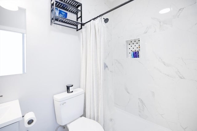 full bathroom with toilet, a stall shower, and vanity