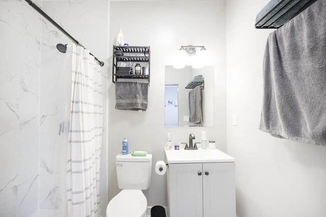 bathroom featuring vanity, toilet, and curtained shower