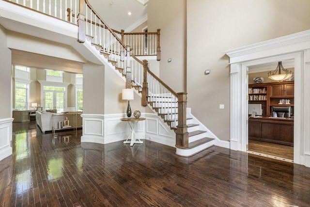 3 Newton Ln, Medway, MA 02053 - entrance foyer featuring hardwood / wood-style flooring, a high ceiling, stairway, a wainscoted wall, and a decorative wall
